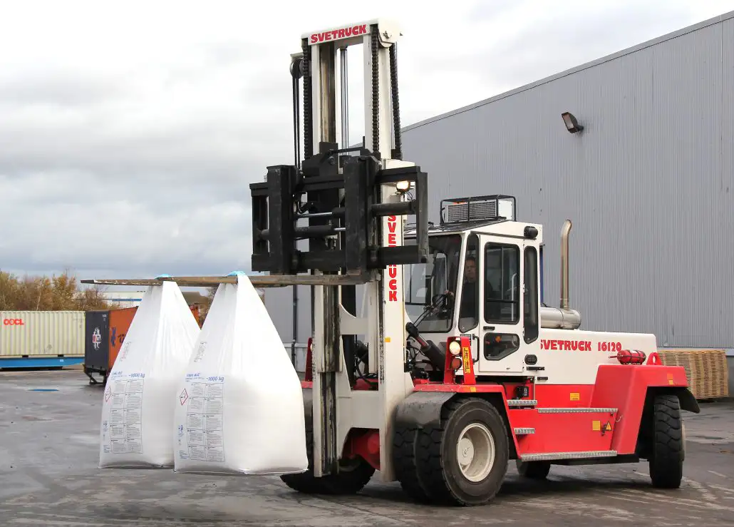 SVETRUCK forklift transporting agricultural bags on a farm